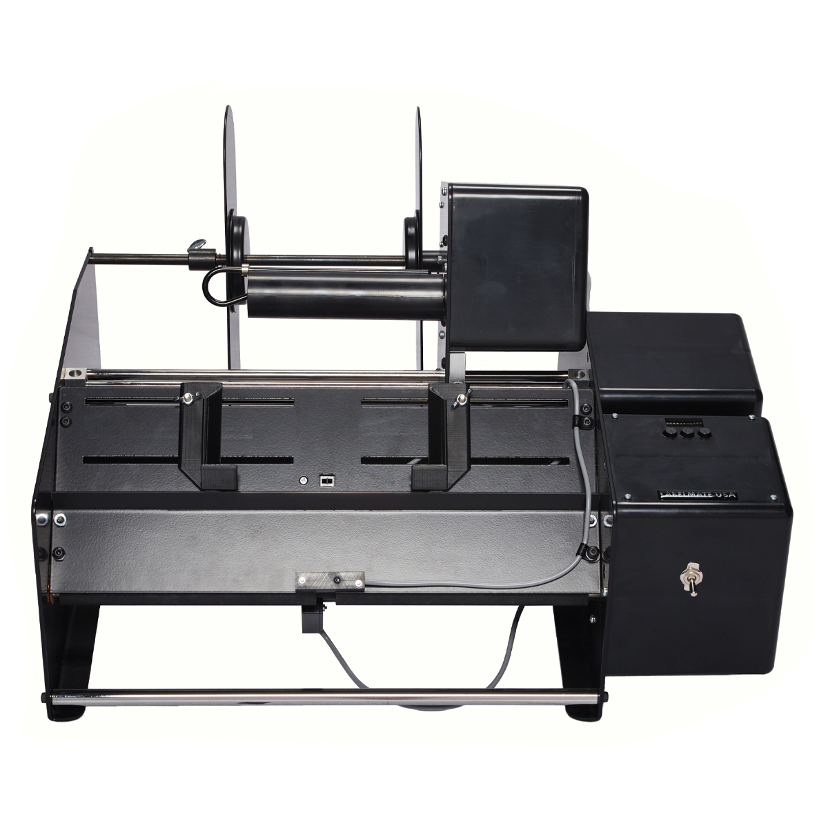 Automatic Label Applicator for bags and other flat items up to 0.20” thick.